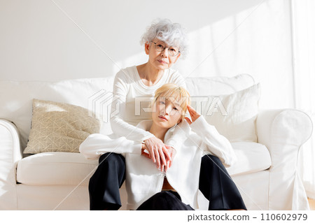 Family portrait of young woman and senior woman 110602979