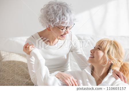 Family portrait of young woman and senior woman 110603157