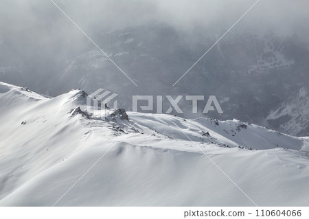 Winter high mountains in clouds 110604066
