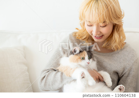 Japanese woman holding a cat 110604138