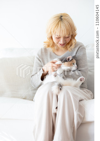 Japanese woman holding a cat 110604145