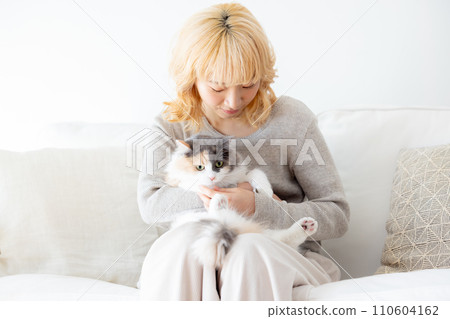 Japanese woman holding a cat 110604162
