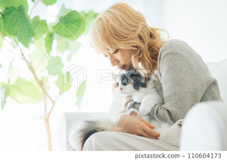 Japanese woman holding a cat 110604173