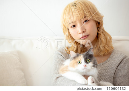 Japanese woman holding a cat 110604182