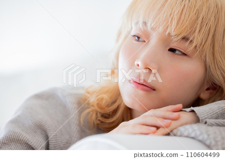 woman relaxing on the sofa woman relaxing on the sofa 110604499