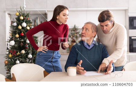 Couple discussing inheritance with older man 110604703