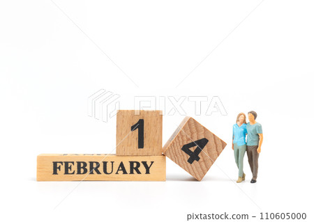 Miniature people man and woman in casual cloth standing together on white background Miniature people man and woman in casual cloth standing together on white background 110605000