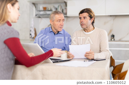 Agent making offer to men Agent making offer to men 110605012