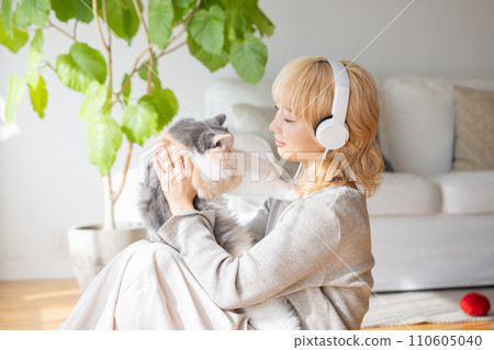 Japanese woman holding a cat Japanese woman holding a cat 110605040