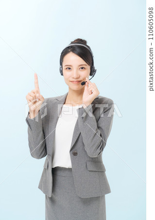 Photo of a female operator pointing her finger 110605098