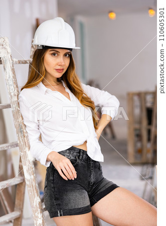 Sexy woman posing in building site 110605301