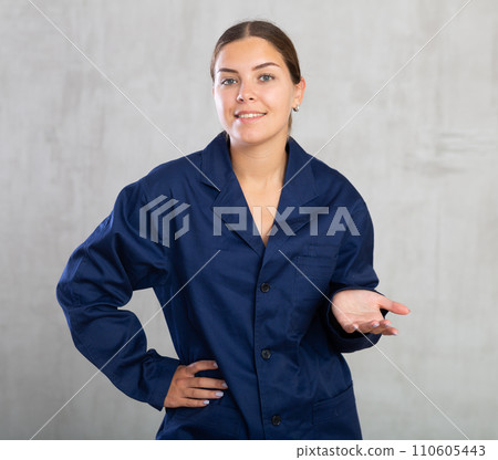Young woman posing in working uniform in studio 110605443