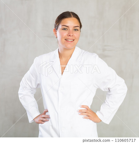 Young woman posing in medical uniform in studio Young woman posing in medical uniform in studio 110605717