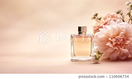 a perfume bottle on beige background with flowers 110606734