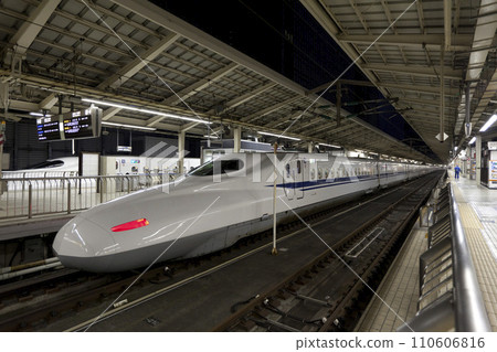 TOKYO - NOV 10,2013: Shinkansen bullet train at Tokyo railway station in November 10,2013 Tokyo, Japan. Shinkansen is world's busiest high-speed railway operated by four Japan Railways companies. 110606816