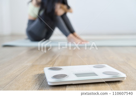 An Asian woman who is depressed because her diet is not going well. An Asian woman who is depressed because her diet is not going well. 110607540