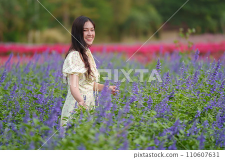 beautiful woman in dress enjoying blooming lavender flower field 110607631