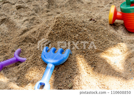 Build a mountain in the sandbox at the park Build a mountain in the sandbox at the park 110608850