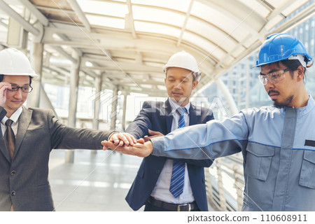 Group of multiracial people Teamwork meeting join hands Engineer Manager Foreman fist bump together. Close up diversity engineer people hands partner teams. Business connection team join partnership Group of multiracial people Teamwork meeting join hands Engineer Manager Foreman fist bump together. Close up diversity engineer people hands partner teams. Business connection team join partnership 110608911