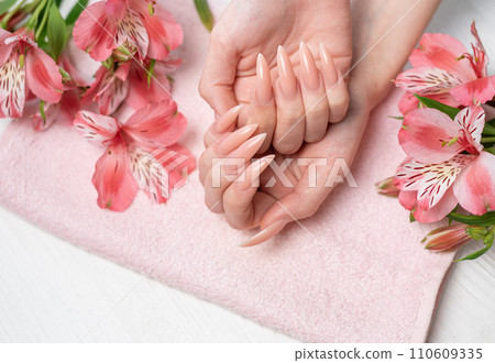 Elegant pastel pink natural manicure. Elegant pastel pink natural manicure. 110609335
