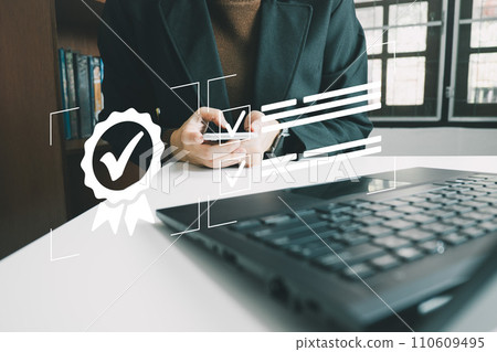 Businesswoman show the symbol of quality assurance by laptop, excellent warranty, world standard, ISO certification, development and improve the quality of the organization concept 110609495