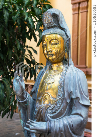 Buddha bronze statue. Gangaramaya Temple, Colombo, Sri Lanka 110610583