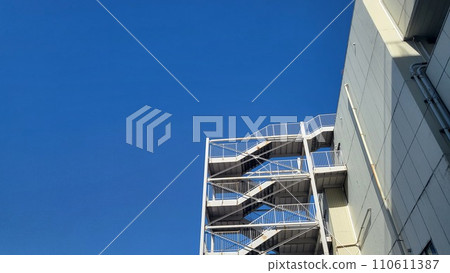 Building emergency stairs and clear blue sky horizontal pattern 1 Building emergency stairs and clear blue sky horizontal pattern 1 110611387