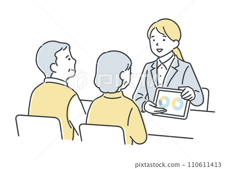 Salesperson giving guidance to a senior couple 110611413