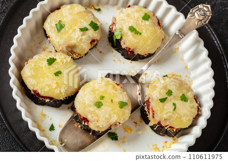 mini eggplant pizzas with tomato sauce and cheese 110611975