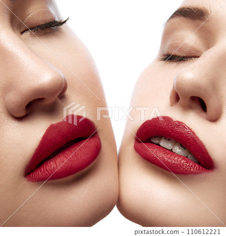 Matte and glossy. Cropped photo of young female faces with plump, moisturized lips with red lipstick. Fashion portrait. 110612221