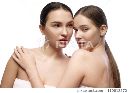 Portrait of young beautiful women, female models with beautiful skin posing together against white studio background. 110612270