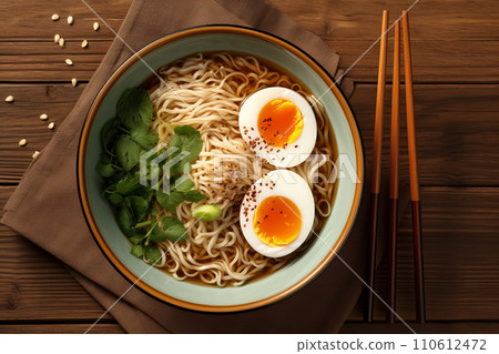 Bowl Japanese ramen. Noodle soup with egg and chop. Top view 110612472