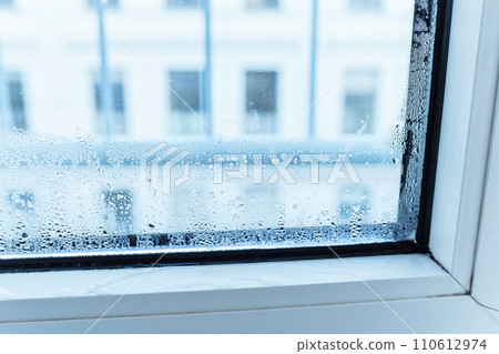 condensation on glass of metal-plastic windows 110612974