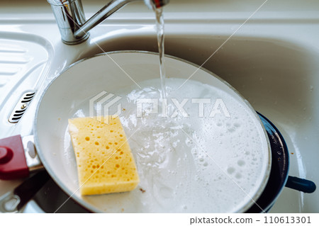 Dirty unwashed dishes in kitchen sink Dirty unwashed dishes in kitchen sink 110613301