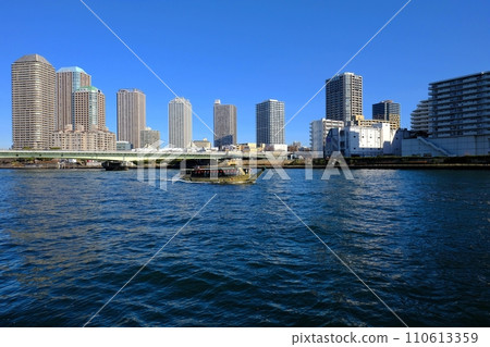 Sumida River scenery, looking towards Tsukuda Ohashi Bridge from in front of St. Luke's Tower Sumida River scenery, looking towards Tsukuda Ohashi Bridge from in front of St. Luke's Tower 110613359