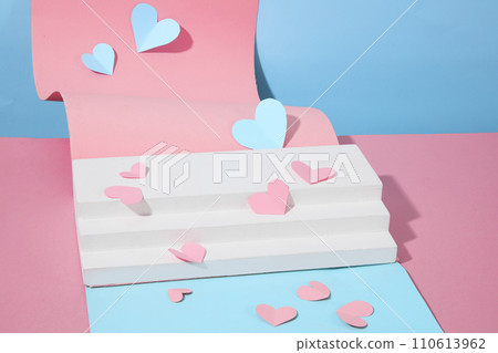 Valentines Day Decoration. Pink and blue color with paper cut in shape of heart decorated with white stairway podium. Blank space for display product. Romantic love concept    110613962