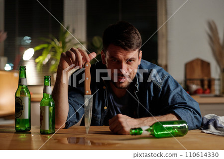 Young man with alcoholic addiction 110614330