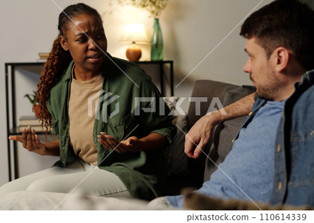 Young annoyed woman talking to husband 110614339