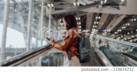 Young asian woman in international airport terminal or modern train station 110614732