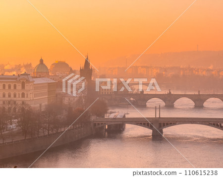 Prague bridge over a river with a city in the background Prague bridge over a river with a city in the background 110615238