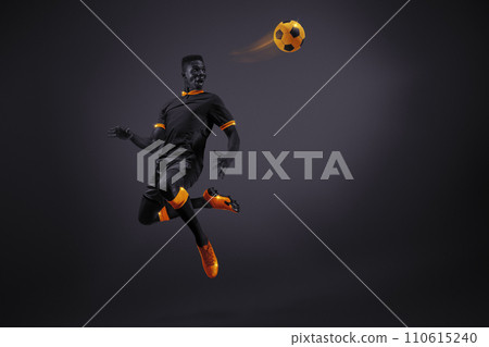 African young man, soccer player in mid-kick with selective orange coloring, illustrating movement and focus. Dynamic image of athlete 110615240