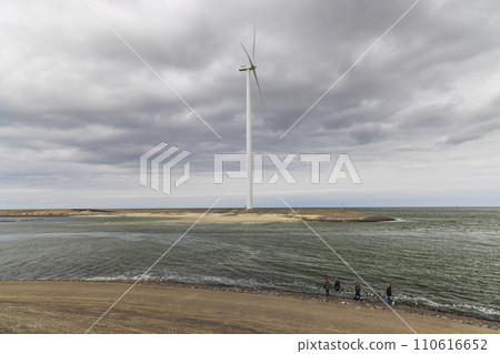 Wind turbines on edge of  national park Oosterschelde, Domburg - Vrouwenpolder, The Netherlands 110616652
