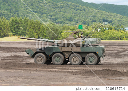 Side view of the Japan Ground Self-Defense Force Type 16 mobile combat vehicle running Side view of the Japan Ground Self-Defense Force Type 16 mobile combat vehicle running 110617714