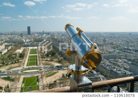 Monocle or tourist telescope on the observation deck with cityscape 110618078