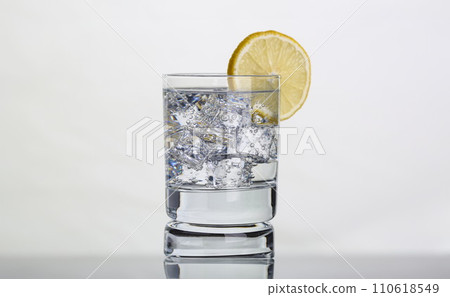 Glass with water and lemon. Lemon water for body health 110618549