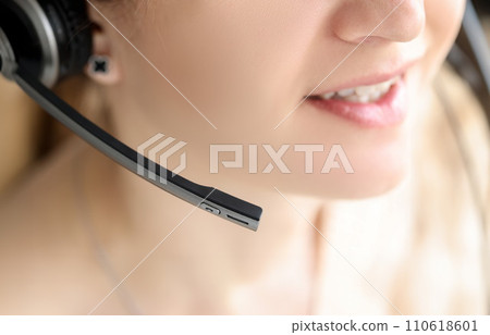 Closeup of black head set on woman head 110618601