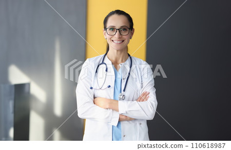 Portrait of smiling doctor in white coat 110618987