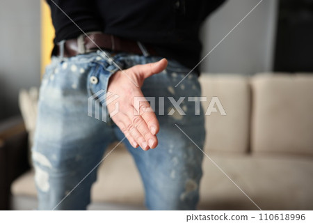 Man offers a handshake through fly of his pants 110618996