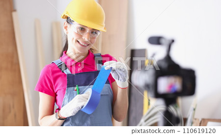 Builder blogger demonstrates blue duct tape for repairs on camera 110619120