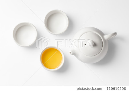 Tea cup set with teapot, mockup on white background, top view Tea cup set with teapot, mockup on white background, top view 110619208
